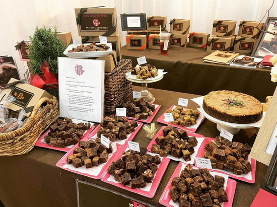 table of brownies and samples at a trasdeshow
